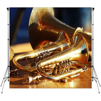 Blowing Brass Wind Instrument On Table Fleece Backdrop