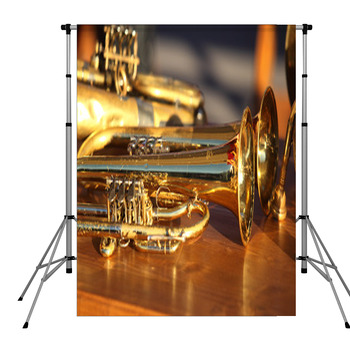 Blowing Brass Wind Instrument On Pole Pocket Backdrop