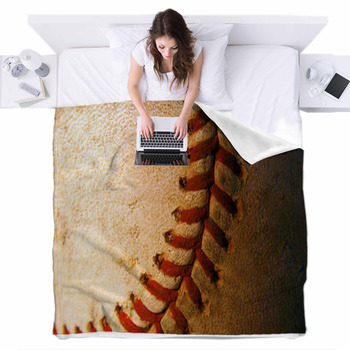 Closeup Of An Old, Weathered Baseball Fleece Bed Blanket
