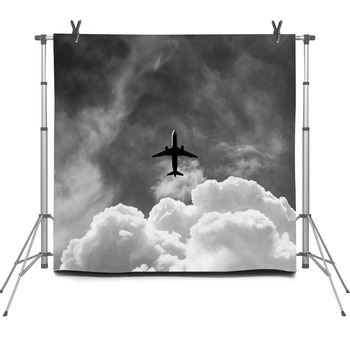 Commercial Aircraft Is Flying Above Fleece Backdrop