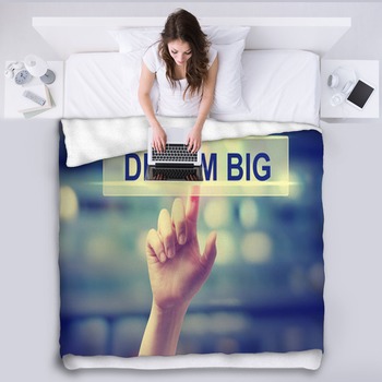 Dream Big Concept With Hand Pressing A Fleece Blanket