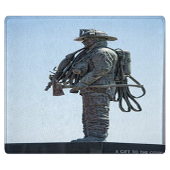 Fireman Statue On The Light Blue Sky Background Bath Mat