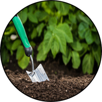 Gardening Shovel In The Soil Round Rug