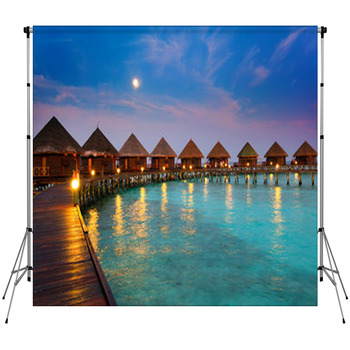 Houses On Piles On Water At Night In  Fleece Backdrop