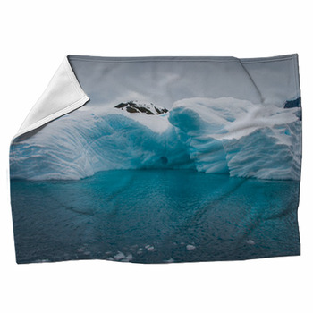 Iceberg Drifting In The Aquamarine Sea Of  Fleece Blanket