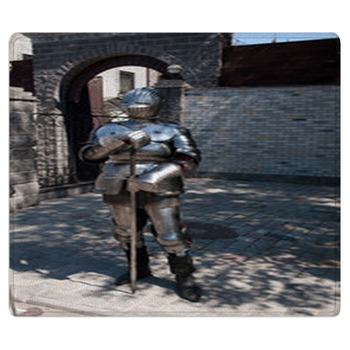 Knight In The Ancient Metal Armor Standing Near  Area Rug