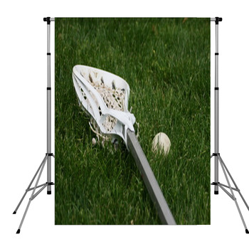 Lacrosse Stick And Ball In Grass Pole Pocket Backdrop