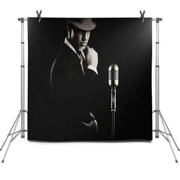 Low Key Portrait Of Jazz Singer In Hat Fleece Backdrop