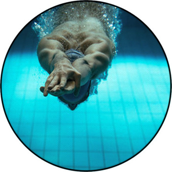 Male Swimmer At The Swimming Pool.Underwater Round Rug