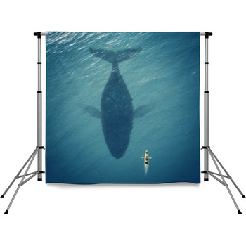 Man In A Boat Floats Next To A Big  Pole Pocket Backdrop