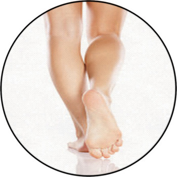 Pretty Female Legs And Bare Feet On White Round Rug