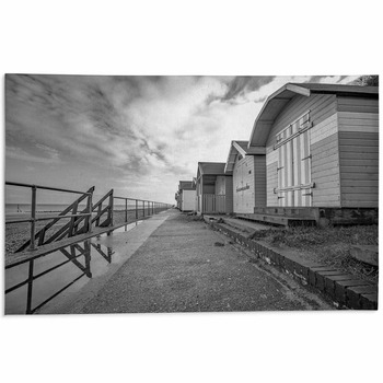 Row Of Traditional Wooden Beach Huts On The Area Rug