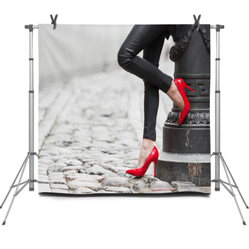 Sexy Legs In Black Leather Pants And Fleece Backdrop