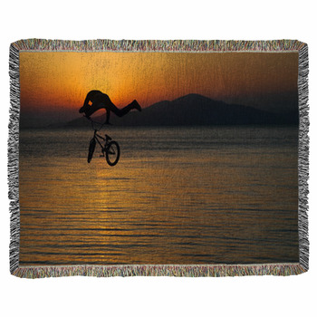 Silhouette Of A Man Doing A Jump Woven Throw Blanket