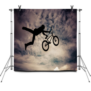 Silhouette Of A Man Doing An Jump With Fleece Backdrop