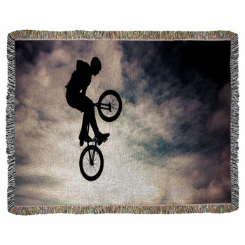 Silhouette Of A Man Doing An Jump Woven Throw Blanket