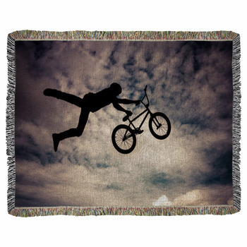 Silhouette Of A Man Doing An Jump Woven Throw Blanket