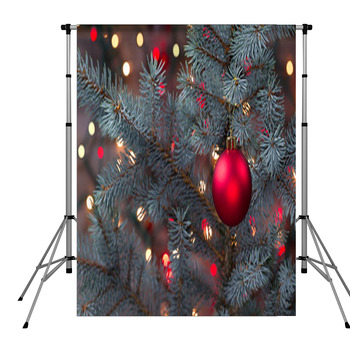 Single Red Ornament Hanging From Pole Pocket Backdrop