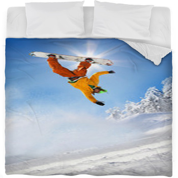 Snowboarder Jumping Against Blue Sky Fleece Bed Blanket