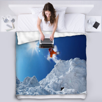 Snowboarder Jumping Against Blue Sky Fleece Blanket
