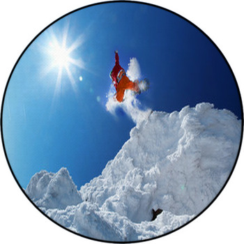 Snowboarder Jumping Against Blue Sky Round Rug