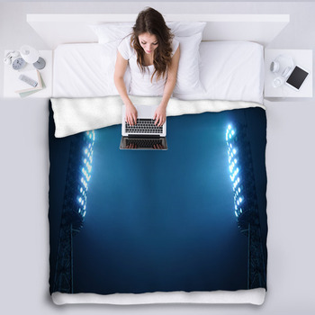 Stadium Lights Against Dark Night Sky Fleece Blanket