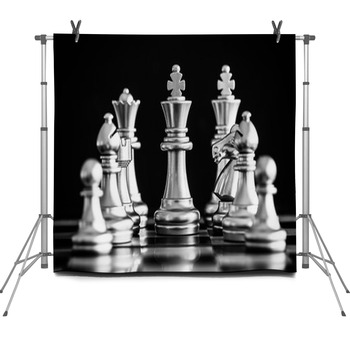 The King in battle chess game stand on chessboard with black
