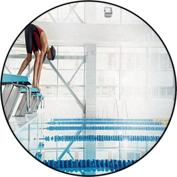 Woman Swimmer In A Starting Position Round Rug