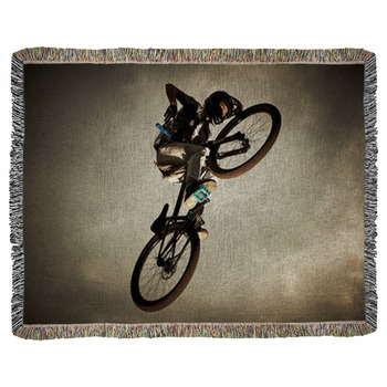 Young Man Flying On His Bike: Dirt Woven Throw Blanket