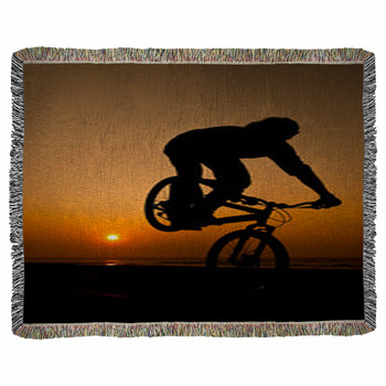 Young Man Performing Bike Tricks Woven Throw Blanket