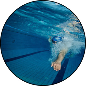 Young Man Swimming In Pool Round Rug